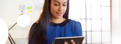 healthcare worker looking at a mobile device